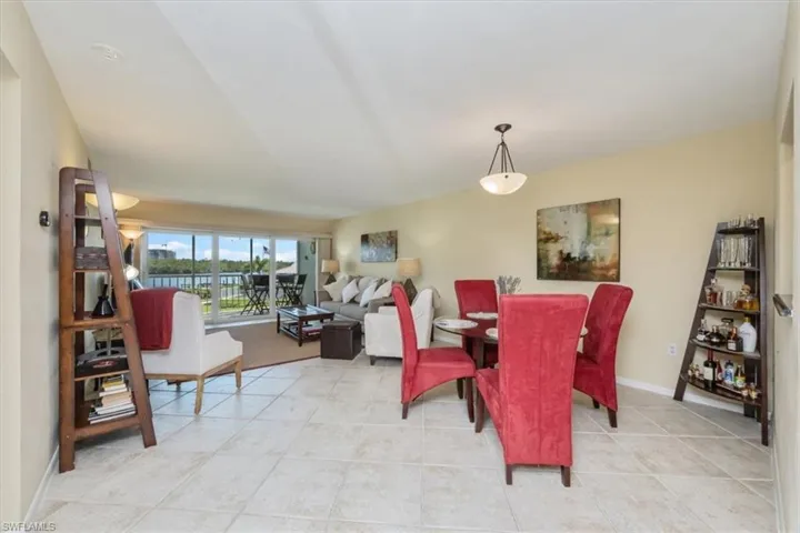 Dining room featuring light tile patterned floors and baseboards