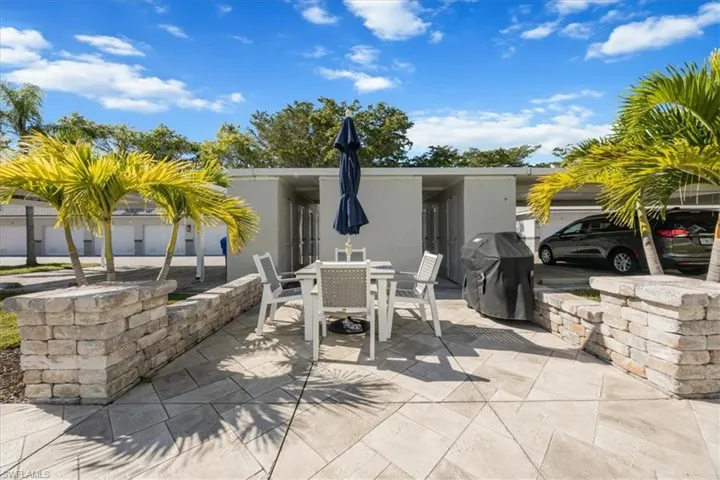 View of Mariners Cove patio featuring grilling area and outdoor dining area