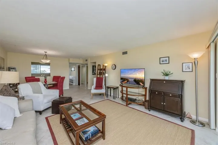 Living room with light tile patterned floors
