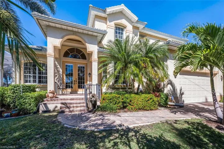 French doors welcome you to this charming boat house!