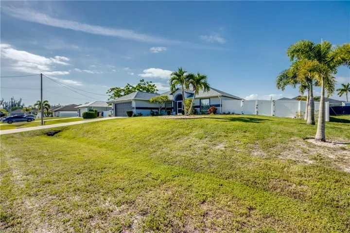 View of front of house featuring a garage and concrete driveway