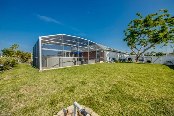 View of yard with glass enclosure