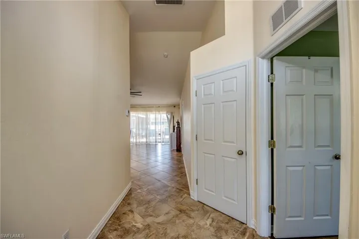 Hallway featuring baseboards