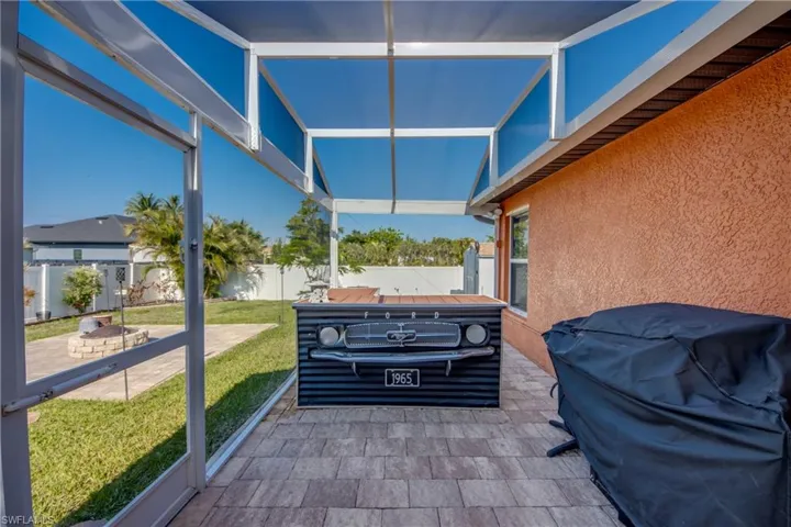 Sunroom with an outdoor fire pit