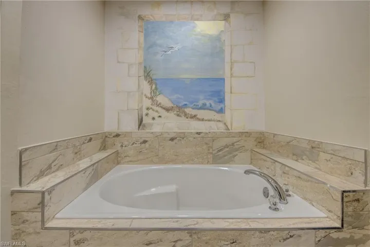 Full bathroom with a bath