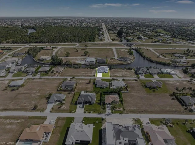 Aerial overview of property's location with nearby suburban area