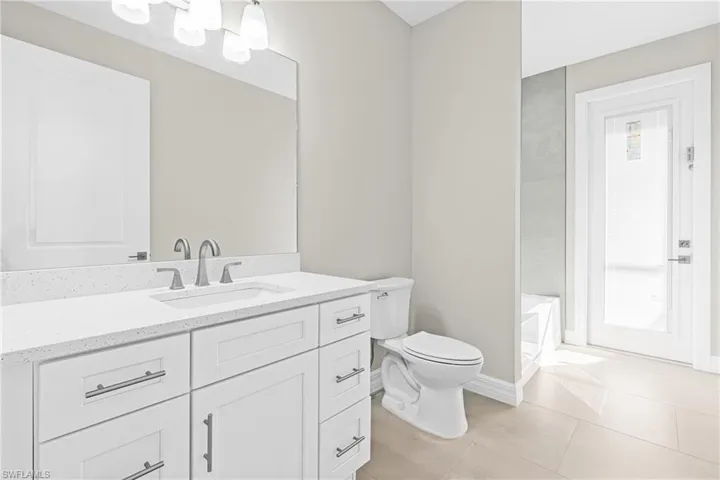 Bathroom featuring vanity and light tile patterned floors