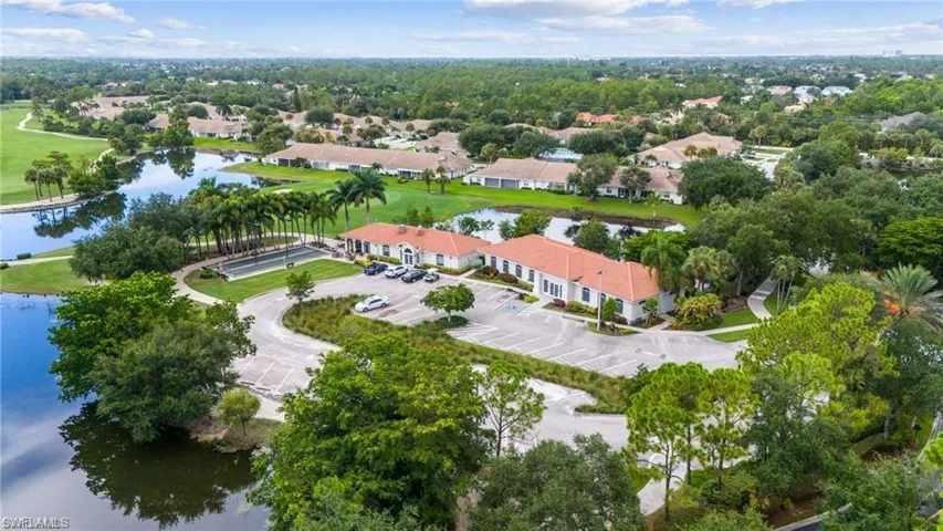 Aerial view of property's location featuring a large body of water and nearby suburban area