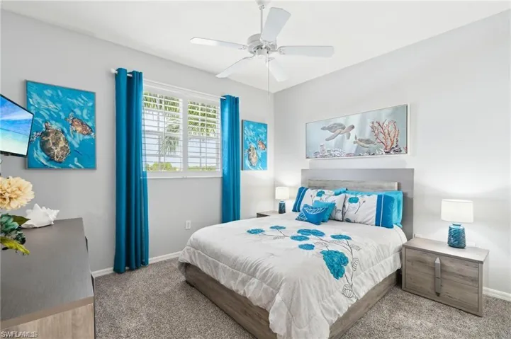 Bedroom featuring carpet floors and ceiling fan