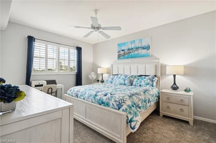 Bedroom with carpet flooring and a ceiling fan