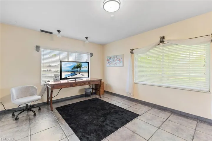 Office space with light tile patterned flooring