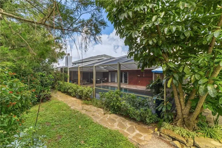 Private side yard with fruit trees and garden
