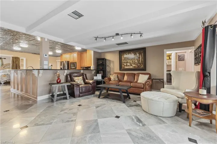 Living room featuring beam ceiling