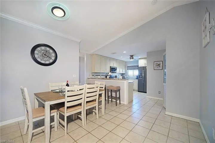 The dining area is between the kitchen and the living room