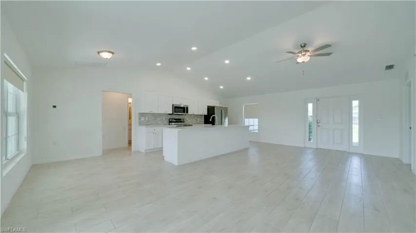Great Room, Dining Room, and Kitchen with plenty of light
