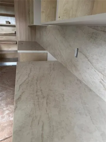 Kitchen view of light stone counters