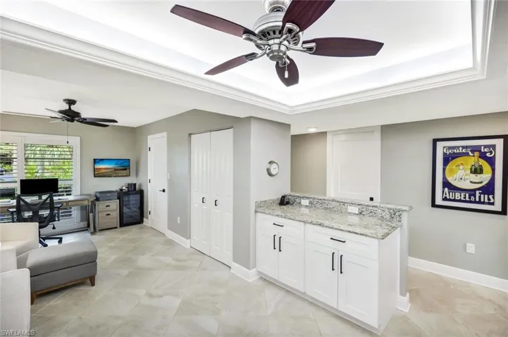 View of Kitchen Leading Into the Front Office/Den with Closet