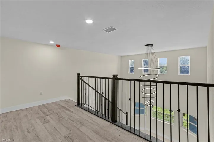 Hallway on second floor featuring light hardwood / wood-style flooring