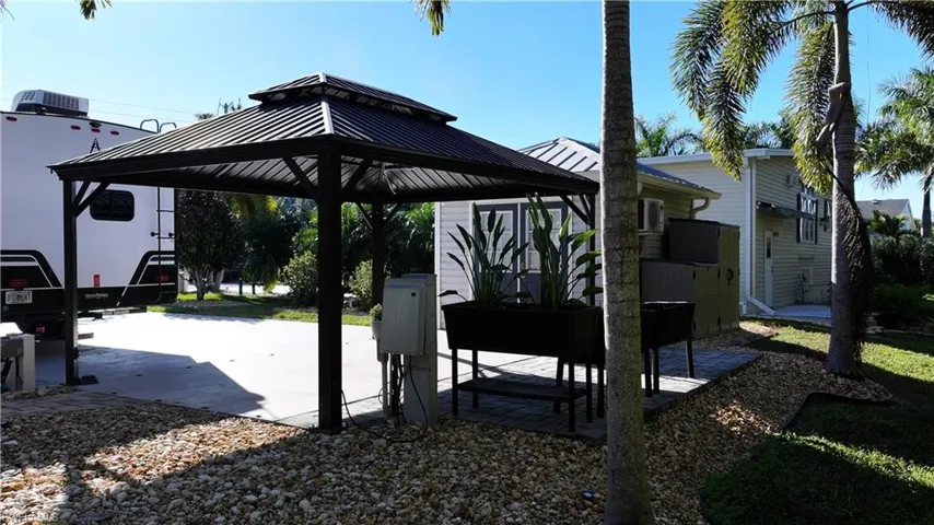 View of patio / terrace with a gazebo and a detached carport