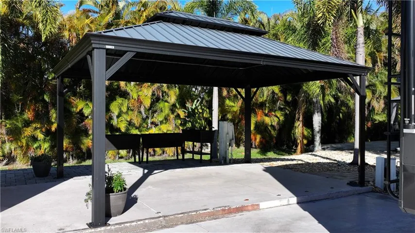 View of home's community with a gazebo and a patio