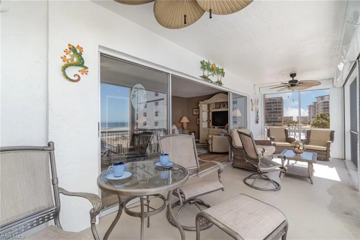 View of patio / terrace featuring ceiling fan, an outdoor hangout area, and a sunroom