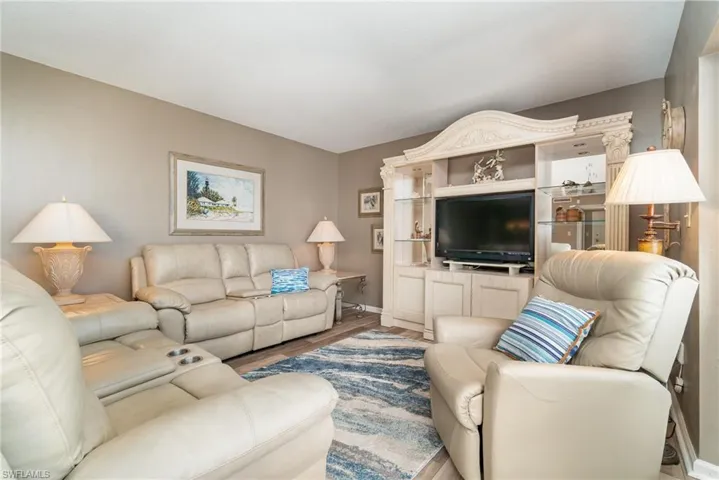 Living room featuring wood finished floors and baseboards