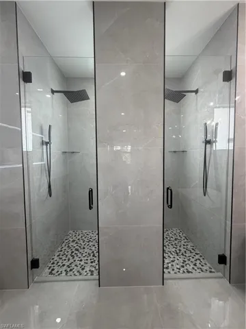 Full bathroom featuring a shower stall