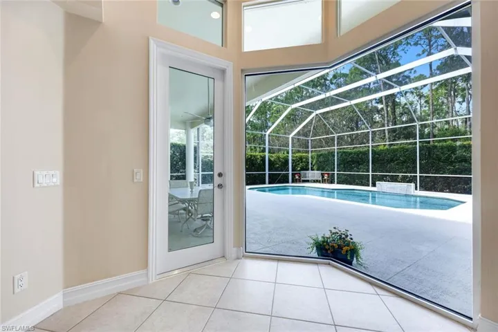 View of pool with a sunroom