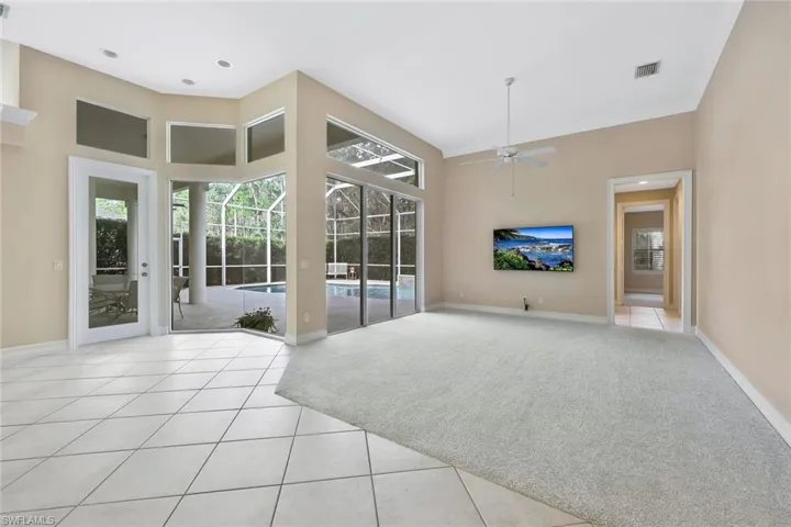 Wonderfully inviting Family Room that overlooks the pool and covered lanai.