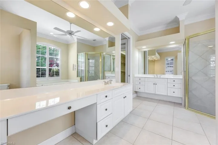 Master Bathroom with two vanities, shower and  separate bathtub.