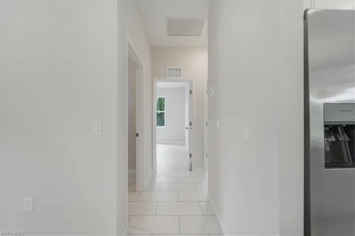 Hallway featuring baseboards