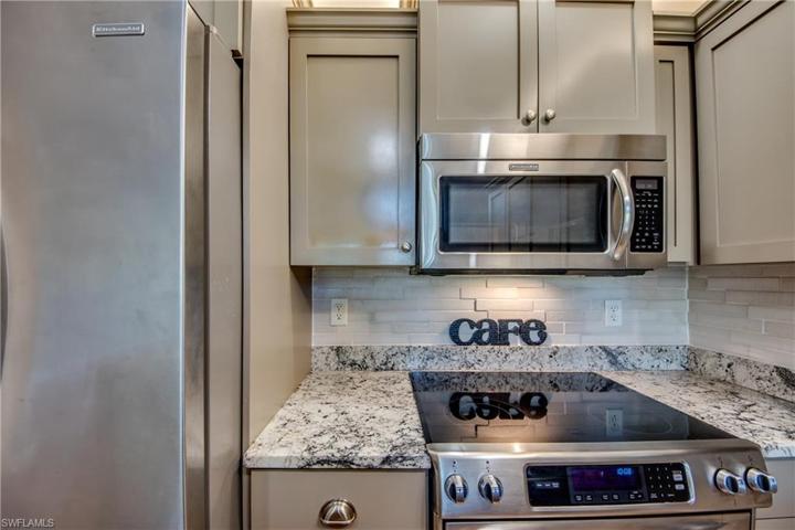 Remodeled Kitchen with Grantie Countertops, Stainless Steel Appliances, backsplash