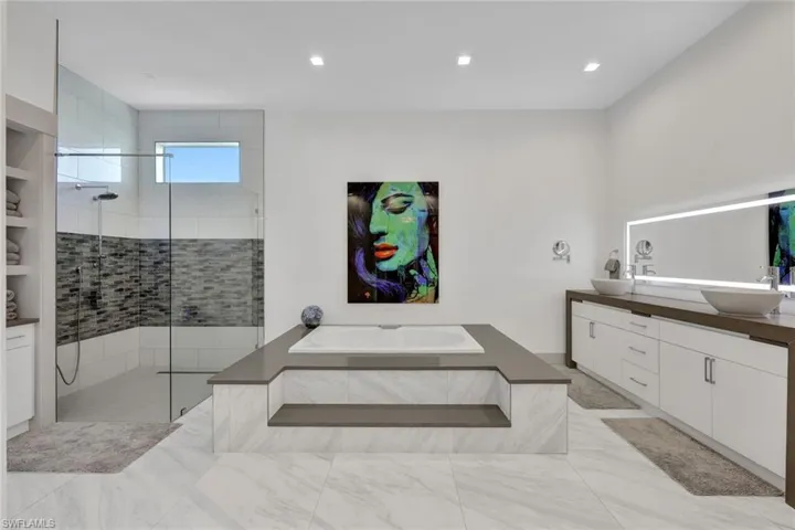1st Floor Luxurious Master Bath with Large Jacuzzi Soaker Tub & Tiled Walk In Shower