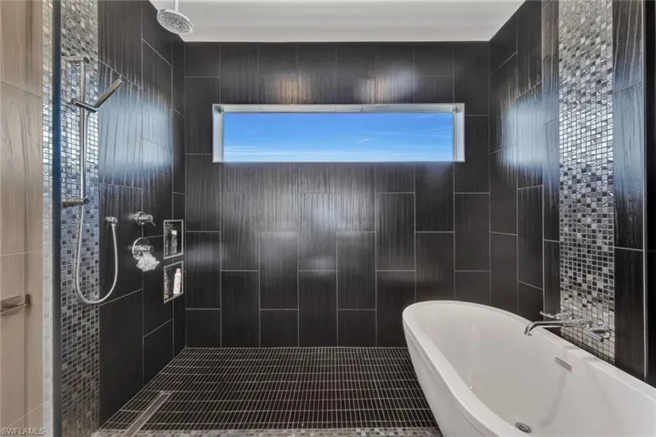 2nd floor bath with huge walk-in shower, multiple shower heads & stylish tub
