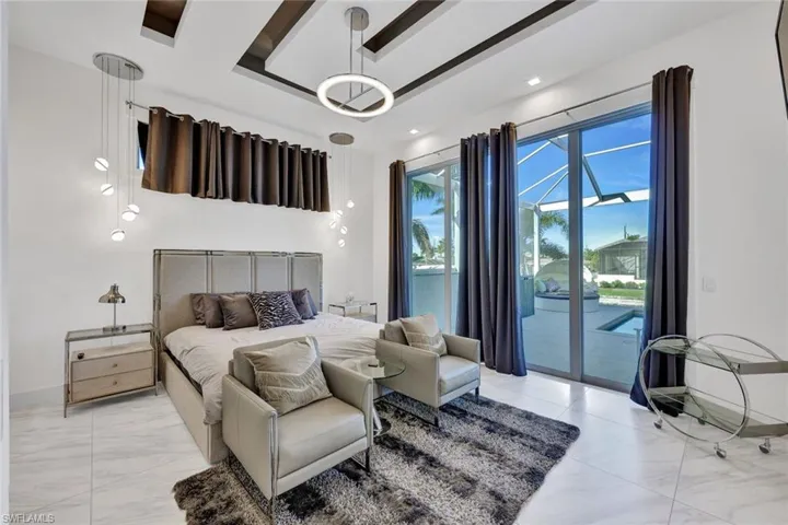 1st Floor Master Bedroom with Sliders that Lead to the Huge Pool Area