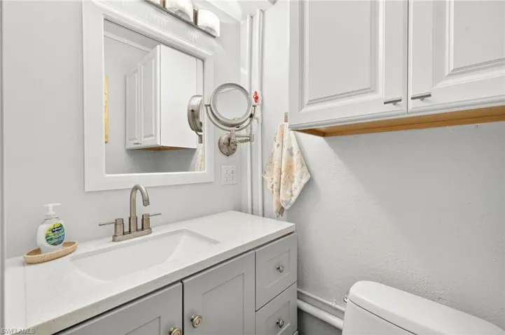 Bathroom with vanity and toilet