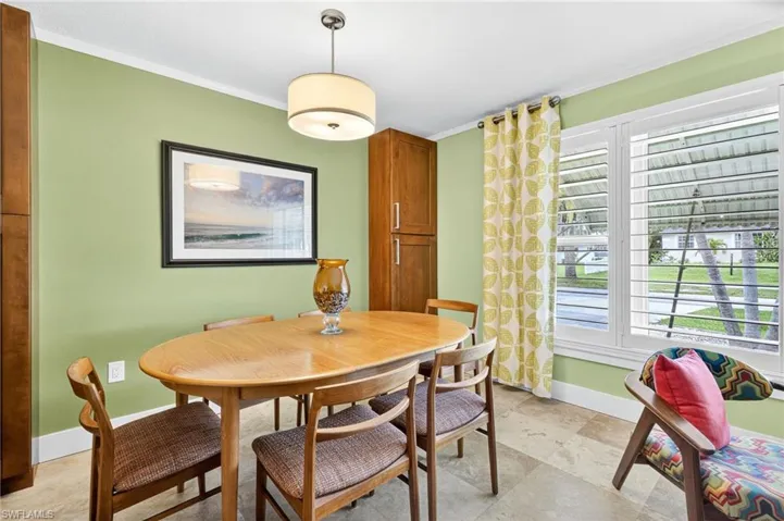 Dining area with crown molding
