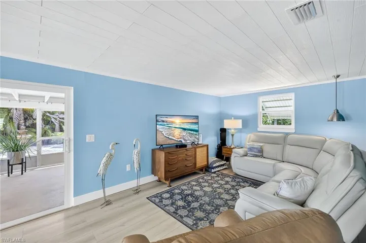 Living area featuring wood ceiling and wood finished floors