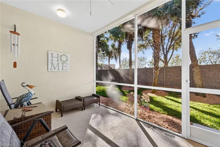 Unfurnished sunroom with ceiling fan