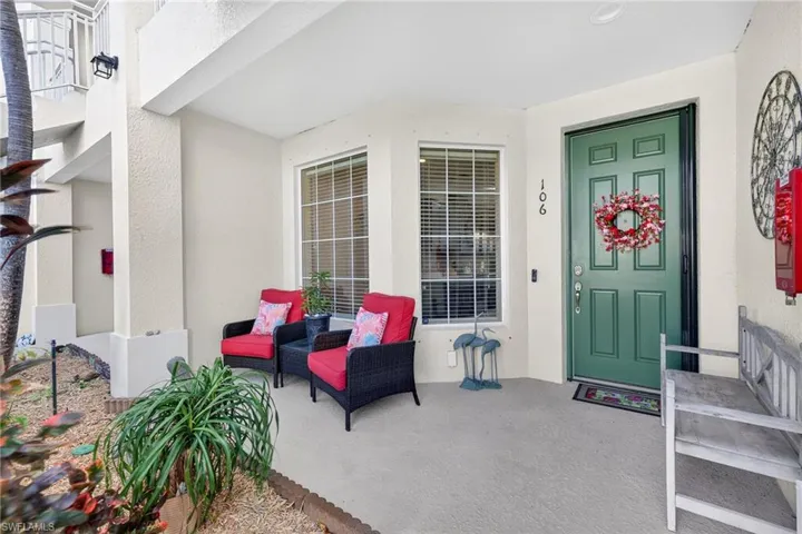 View of exterior entry with stucco siding