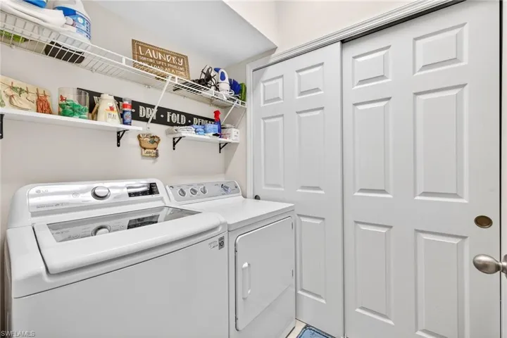 Washroom featuring independent washer and dryer