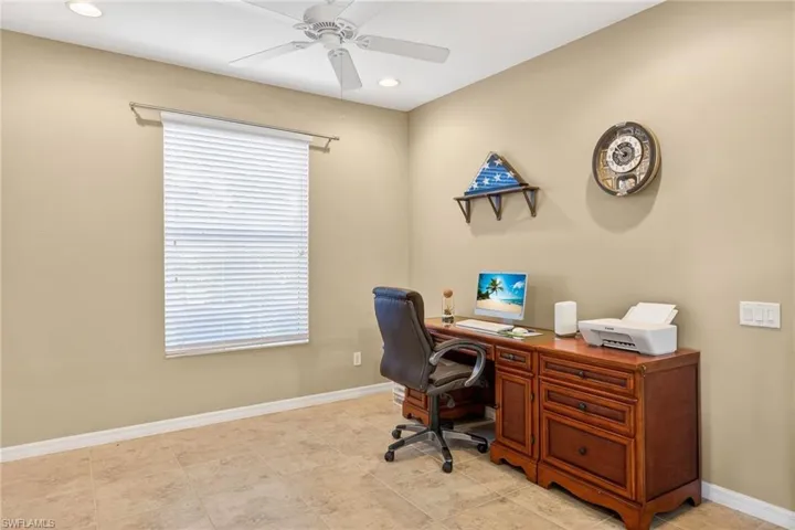 Home office featuring ceiling fan and recessed lighting