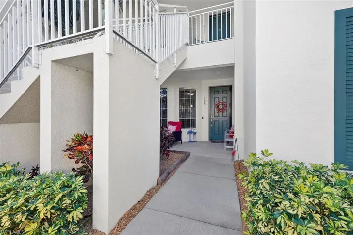 Entrance to property featuring stucco siding