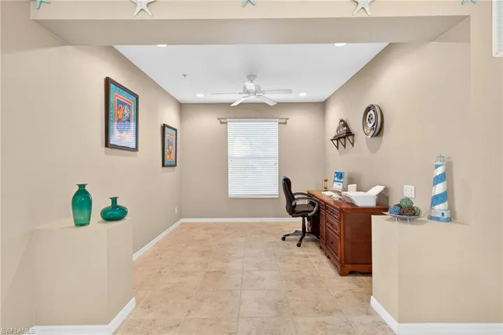 Office with ceiling fan, recessed lighting, and light tile patterned flooring