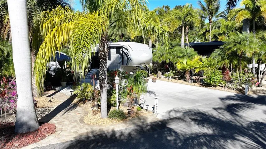 View of community with concrete driveway