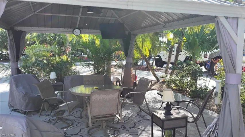 View of patio / terrace with a gazebo and outdoor dining area