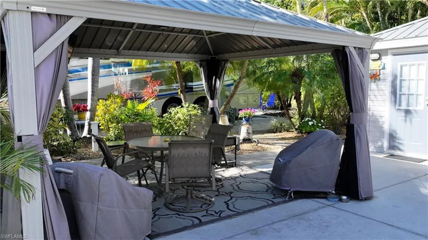 View of patio / terrace with a gazebo and outdoor dining area