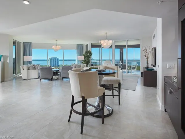 Dining space featuring a chandelier and a water view
