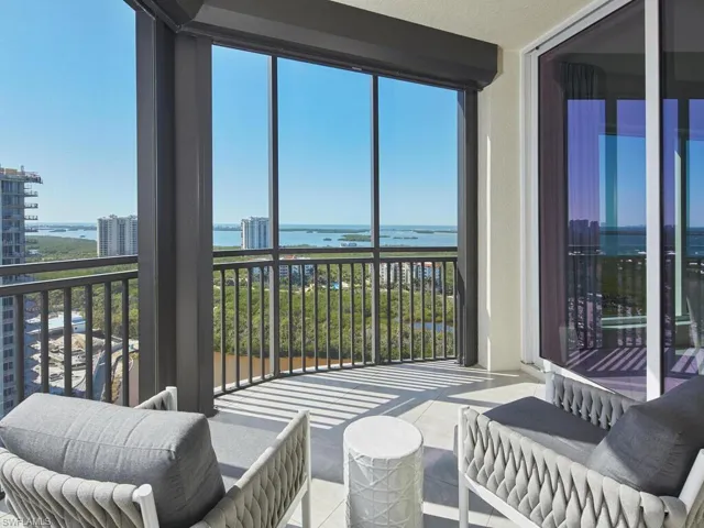 Sunroom / solarium featuring a water view