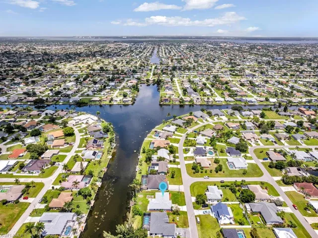 View of property location featuring nearby suburban area and a large body of water